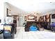 Spacious living room featuring tile flooring, a comfortable sofa, and natural light at 11411 N 19Th St, Tampa, FL 33612