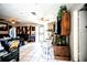 Bright, open living room with tile flooring, multiple ceiling fans, and a view of adjacent rooms at 11411 N 19Th St, Tampa, FL 33612