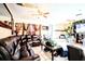 Open living room with tile flooring, stone fireplace, and ample seating, perfect for entertaining at 11411 N 19Th St, Tampa, FL 33612