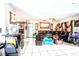 Spacious living room featuring tile flooring, a comfortable sofa, and natural light at 11411 N 19Th St, Tampa, FL 33612