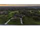 Expansive estate featuring manicured grounds, mature trees, and a long driveway leading to the grand home at 11441 Hammock Oaks Ct, Lithia, FL 33547