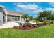 Expansive backyard featuring a pool, patio, lush landscaping, and a well-maintained lawn at 11441 Hammock Oaks Ct, Lithia, FL 33547