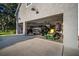 Spacious three-car garage with ample storage space and room for multiple vehicles at 11441 Hammock Oaks Ct, Lithia, FL 33547