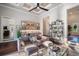 Open living room with elegant decor, coffered ceilings, built in bar and a shelving unit at 11441 Hammock Oaks Ct, Lithia, FL 33547
