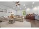 Relaxing living room features neutral colors, hardwood floors, recessed lighting, and comfortable seating at 11441 Hammock Oaks Ct, Lithia, FL 33547