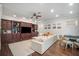 Open-concept living area features hardwood floors, a large built-in entertainment center, and natural light at 11441 Hammock Oaks Ct, Lithia, FL 33547