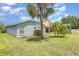 Beautiful backyard featuring well-maintained lawn and lush landscaping at 11620 Crest Creek Dr, Riverview, FL 33569
