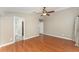 Large bedroom with wood floors and an en-suite bathroom at 11620 Crest Creek Dr, Riverview, FL 33569