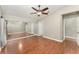 Large bedroom with wood floors and a mirrored closet at 11620 Crest Creek Dr, Riverview, FL 33569