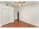 Bright bedroom featuring hardwood floors, closet, and a ceiling fan at 11620 Crest Creek Dr, Riverview, FL 33569
