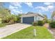 Attractive one-story home with a two-car garage, well-kept lawn, and lush landscaping at 11620 Crest Creek Dr, Riverview, FL 33569