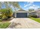 Charming single-story home featuring a two-car garage, beautiful landscaping, and a well-maintained lawn at 11620 Crest Creek Dr, Riverview, FL 33569