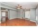Spacious living room featuring hardwood floors, neutral paint, and a ceiling fan at 11620 Crest Creek Dr, Riverview, FL 33569