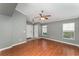 Bright and open living room with hardwood floors, neutral paint, and ample natural light at 11620 Crest Creek Dr, Riverview, FL 33569