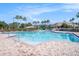 The pool features a fenced perimeter, sun loungers and tables for residents to relax and enjoy the outdoors at 11620 Crest Creek Dr, Riverview, FL 33569