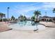 A zero entry outdoor pool features comfortable seating, palm trees, and well-maintained landscaping for a resort-style experience at 11620 Crest Creek Dr, Riverview, FL 33569