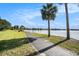 Enjoy scenic walks along a paved path, surrounded by lush landscaping and a beautiful lake view at 11620 Crest Creek Dr, Riverview, FL 33569