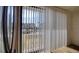 Balcony view with white blinds and view of community swimming pool at 128 1St Street E. # 102, Tierra Verde, FL 33715