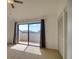 Bedroom featuring carpet, sliding glass doors to the balcony, and a closet at 128 1St Street E. # 102, Tierra Verde, FL 33715