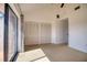 Light-filled bedroom with neutral carpet, large closets, and sliding glass door to a private balcony at 128 1St Street E. # 102, Tierra Verde, FL 33715