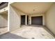 Exterior view showing unit entrance with a covered garage, ensuring ease of access and vehicle protection at 128 1St Street E. # 102, Tierra Verde, FL 33715