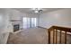 Bright living room with carpet floors, fireplace, and balcony access via sliding glass doors at 128 1St Street E. # 102, Tierra Verde, FL 33715