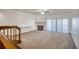 Spacious living room features carpet flooring, a fireplace, and sliding glass doors to balcony at 128 1St Street E. # 102, Tierra Verde, FL 33715