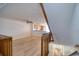 Bright living area featuring tile flooring, open access to kitchen and staircase at 128 1St Street E. # 102, Tierra Verde, FL 33715