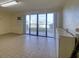 Spacious, sunny living area with tile flooring, ready for personalization and overlooking a picturesque harbor view at 128 1St Street E. # 102, Tierra Verde, FL 33715