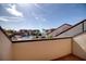Balcony view featuring community swimming pool and gathering area with tropical umbrellas and landscaping at 128 1St Street E. # 102, Tierra Verde, FL 33715