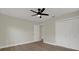 Bedroom featuring ceiling fan, light walls, hardwood floors and closet at 1352 Parkwood St, Clearwater, FL 33755