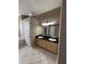 Bathroom featuring a double sink vanity with black granite countertop and tile floors at 13632 Deventer Ct., Hudson, FL 34667