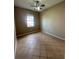 Comfortable bedroom featuring a ceiling fan and a window for natural lighting at 13632 Deventer Ct., Hudson, FL 34667
