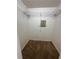 A standard walk-in closet includes carpet flooring and metal shelving for optimal storage and organization at 13632 Deventer Ct., Hudson, FL 34667