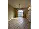 The dining room features ceramic tile floors, modern light fixtures, and large windows that fill the room with light at 13632 Deventer Ct., Hudson, FL 34667