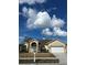 Charming one-story home showcasing a well-maintained lawn and a welcoming two-car garage at 13632 Deventer Ct., Hudson, FL 34667