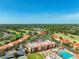 Aerial view showcasing the community's pool, tennis courts, and landscaped grounds at 13941 Clubhouse Dr # 308, Tampa, FL 33618