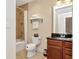 Bathroom featuring bathtub with shower and granite sink at 13941 Clubhouse Dr # 308, Tampa, FL 33618