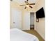 Comfortable bedroom with ceiling fan and closet space at 13941 Clubhouse Dr # 308, Tampa, FL 33618