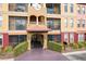 Beautiful condominium building with arched entrance, desert landscaping, and warm color scheme at 13941 Clubhouse Dr # 308, Tampa, FL 33618