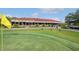 Golf course clubhouse with outdoor seating and scenic views of the green at 13941 Clubhouse Dr # 308, Tampa, FL 33618