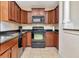 Well-equipped kitchen featuring stainless steel appliances, ample cabinets, and granite countertops at 13941 Clubhouse Dr # 308, Tampa, FL 33618