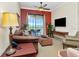 Inviting living room with cozy seating, perfect for relaxation and entertaining guests at 13941 Clubhouse Dr # 308, Tampa, FL 33618