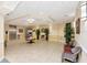 Elegant lobby area with tile flooring, comfortable seating, and decorative plants at 13941 Clubhouse Dr # 308, Tampa, FL 33618