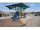 Community playground featuring a covered slide and tic-tac-toe activity center at 13941 Clubhouse Dr # 308, Tampa, FL 33618
