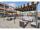 Community pool area offers comfortable outdoor seating near the splash pad, ideal for relaxation and leisure at 13941 Clubhouse Dr # 308, Tampa, FL 33618