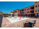 Community splash pad with colorful water features and seating area nearby at 13941 Clubhouse Dr # 308, Tampa, FL 33618