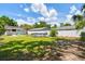 Fenced backyard features lush lawn and landscaping, an above-ground pool and room for outdoor activities at 1420 W Rambla St, Tampa, FL 33612