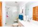 Bright bathroom with a glass-enclosed shower, modern fixtures, and vanity at 1512 W Sitka St, Tampa, FL 33604