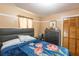 Cozy bedroom with closet, neutral colors and comfortable bed at 1512 W Sitka St, Tampa, FL 33604